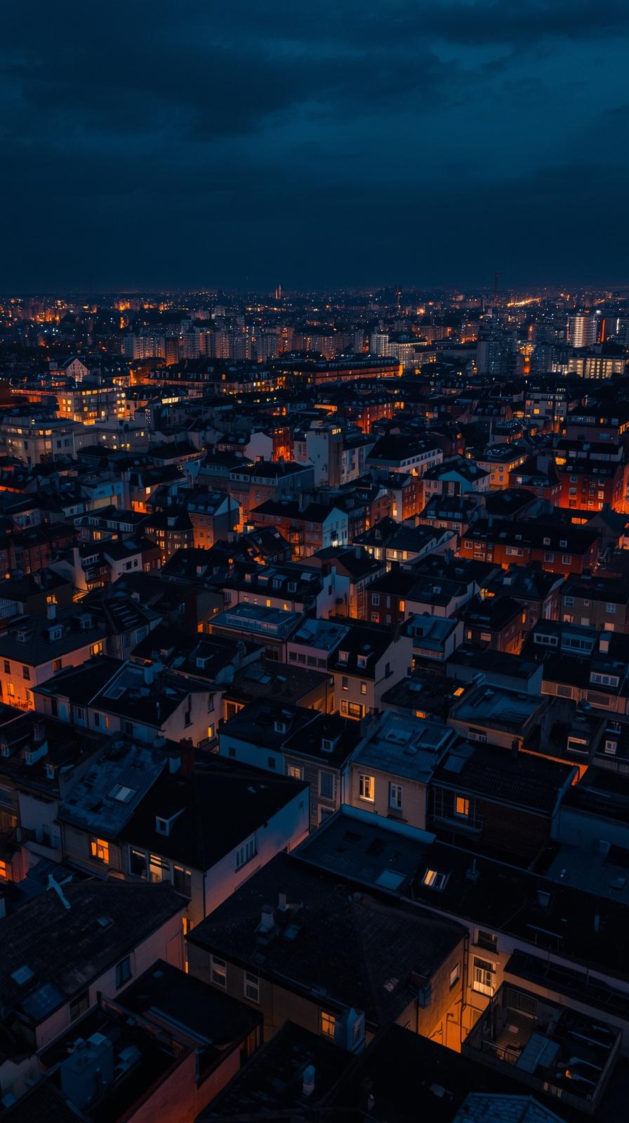 City Rooftops At Night With Glowing Windows