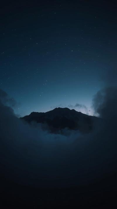 Dark Moody Mountain Silhouette At Dusk With Mist A